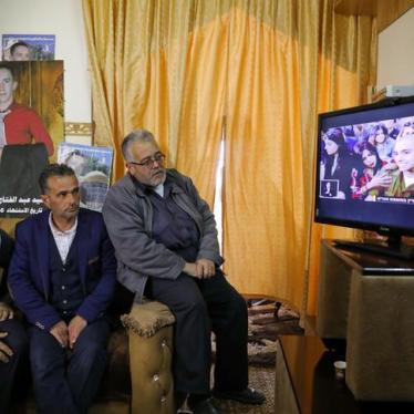 The father and relatives of Palestinian Abd Elfatah Ashareef watch the TV broadcast of the sentencing hearing of Israeli soldier Elor Azaria, in the West Bank City of Hebron February 21, 2017.