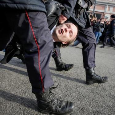 Law enforcement officers detains an opposition supporter during a rally in Moscow, Russia.