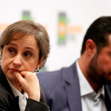 Mexican journalist Carmen Aristegui listens beside Mario Patron, Director of Human Rights Center Miguel Agustin Pro Juarez (PRODH) during a news conference in Mexico City, Mexico June 19, 2017