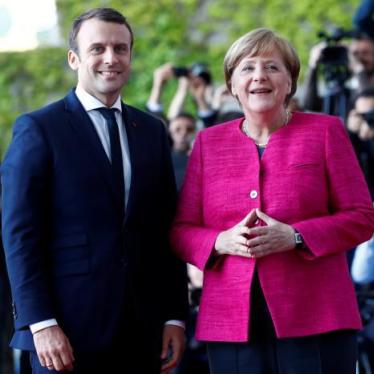 German Chancellor Angela Merkel and French President Emmanuel Macron arrive at a ceremony at the Chancellery in Berlin, Germany, May 15, 2017. 