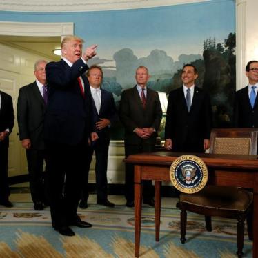 U.S. President Donald Trump accuses a CNN reporter of being "fake news" after signing a memorandum directing the U.S. Trade Representative to complete a review of trade issues with China at the White House in Washington, U.S. August 14, 2017.