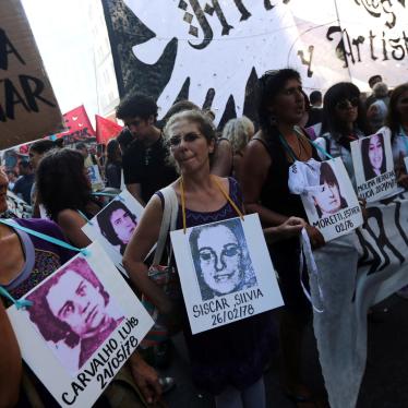 Demonstrators carry pictures of people who disappeared during Argentina's last military dictatorship at commemorations of the 41st anniversary of the coup that ushered in the dictatorship in Buenos Aires, Argentina, March 24, 2017.