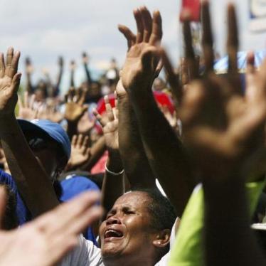 Christian Papuans sing a religious song during a protest in Jayapura of the Indonesia Papua province August 5, 2008. About 1,000 Papuan rally on Tuesday against Indonesian government's plan to implement Islamic sharia law in the Christian stronghold. REUT