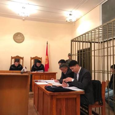 Murat Tungishbaev, an activist facing extradition to Kazakhstan from Kyrgyzstan, sits in the defendant’s cage during his remand hearing on May 28, 2018. 