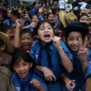 Students celebrate in front of Chiang Rai Prachanukroh hospital, where the 12 soccer players and their coach rescued from the Tham Luang cave complex are being treated, in Chiang Rai, Thailand.