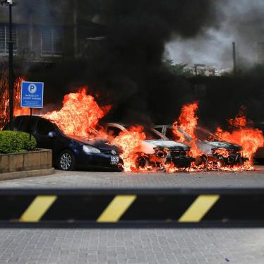 Burning cars are seen at the scene where explosions and gunshots were heard at the Dusit hotel compound, in Nairobi, Kenya January 15, 2019. 