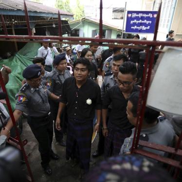 Zayar Lwin, center left, member of Student Union and a leader of Peacock Generation "Thangyat" Performance Group, talks as he leaves a township court along with his colleague Paing Phyo Min, right, after their trial Wednesday, Oct. 30, 2019, in Yangon, My