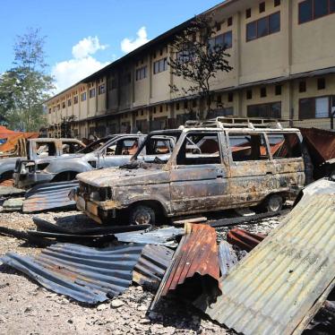Burnt out vehicles stretch across a parking lot from Monday's violent protest in Wamena, Papua province, Indonesia, Tuesday, Sept. 24, 2019. 