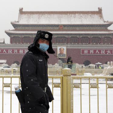 A police officer wears a mask in front of Tiananmen Gate in Beijing, China, February 5, 2020.